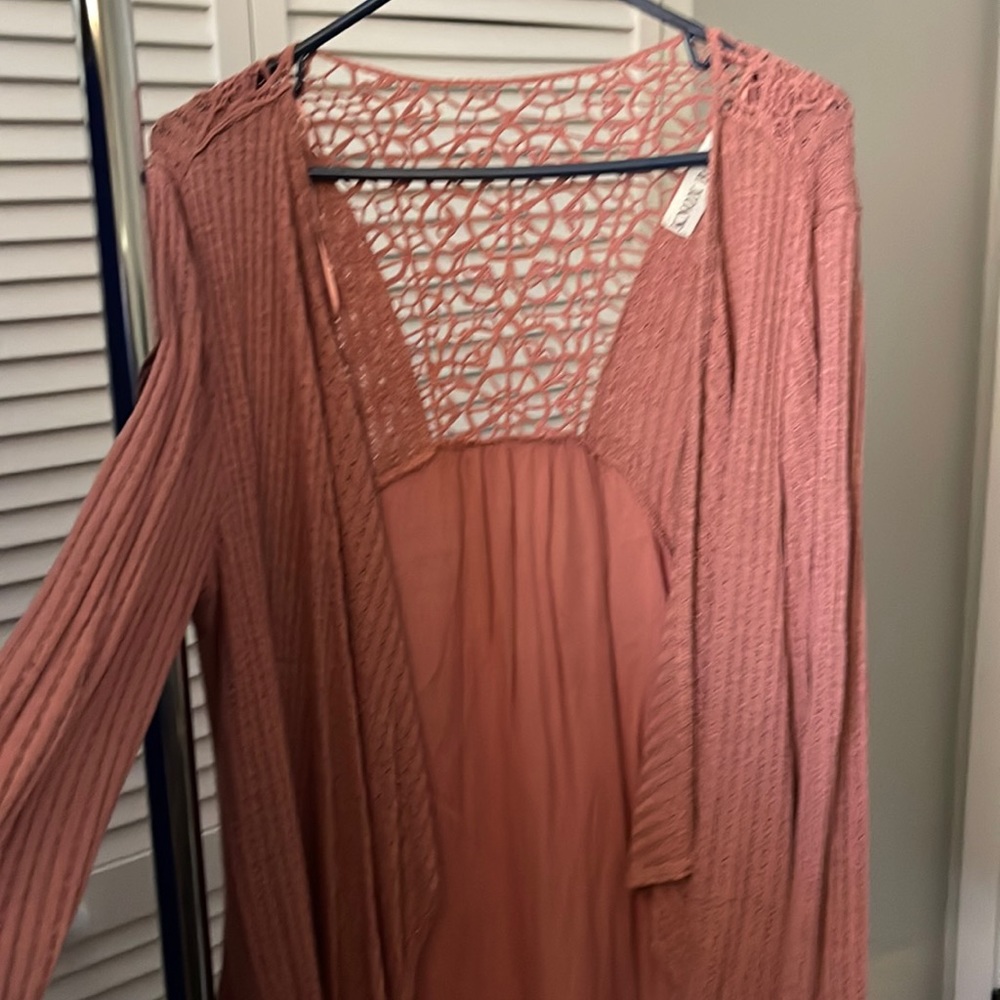 Rose pink cardigan sweater.